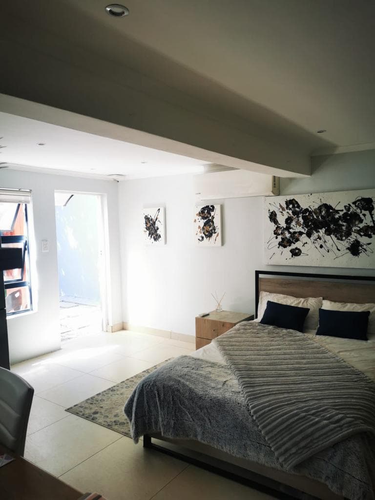 Bright furnished bedroom with garden access